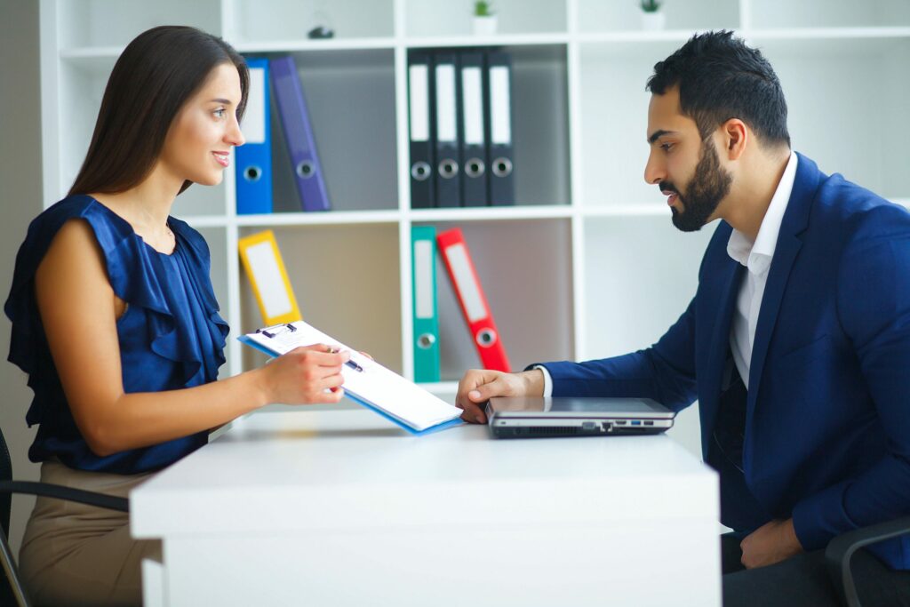 Home buyer talking to loan officer about getting a low interest rate