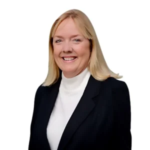 Laurie Smith - WBG - 500x500 Laurie Smith professional headshot wearing a black blazer over a white turtleneck sweater against a light gray background.