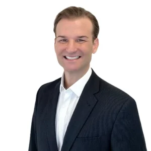 Steve Dillman - WBG - 500x500 Steve Dillman professional headshot wearing a dark suit jacket and white dress shirt against a light neutral background.