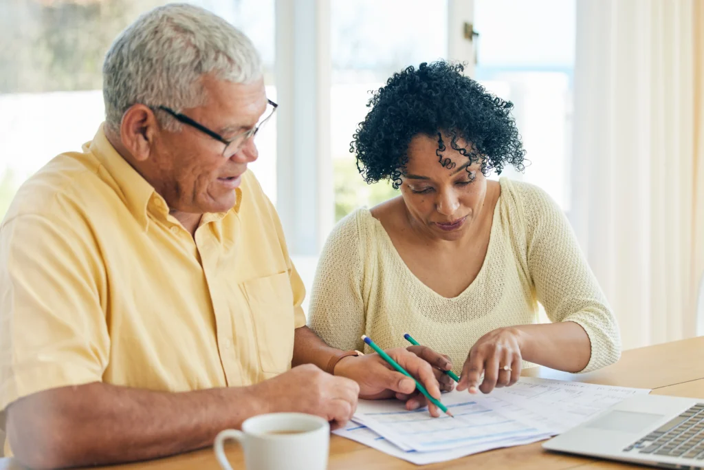 senior-couple-reviewing-finances-together-at-home-2026-03-25-02-46-11-utc (1)