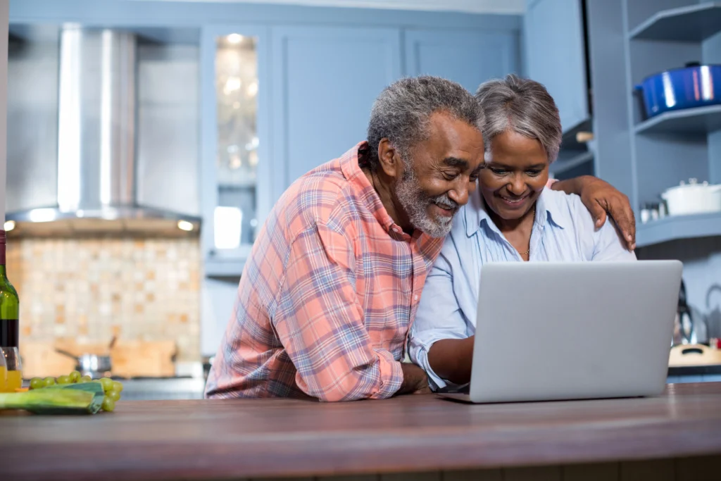 senior-couple-enjoying-time-together-using-laptop-2026-03-25-09-01-09-utc